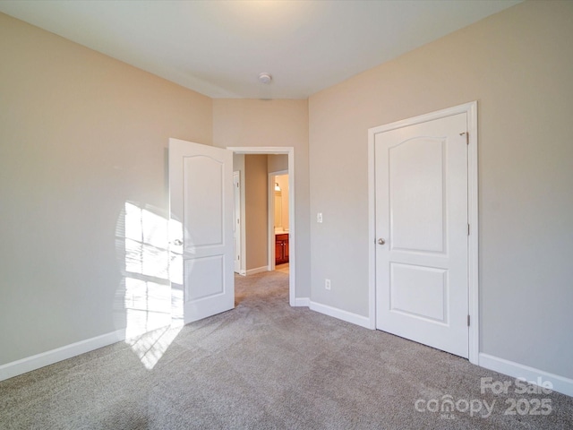 unfurnished bedroom with light colored carpet