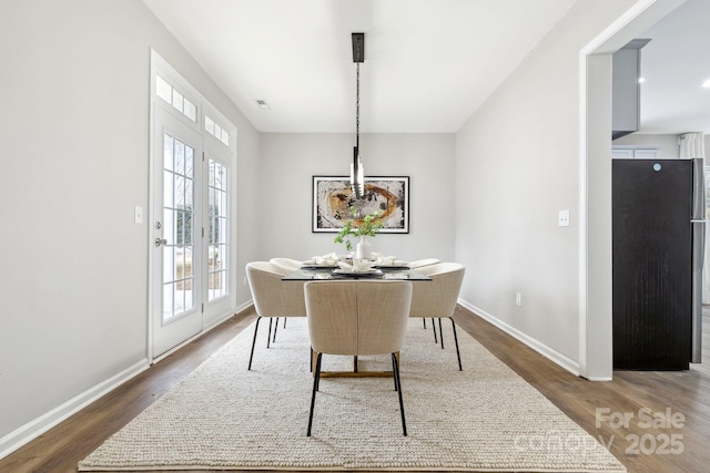 dining space with dark wood-type flooring