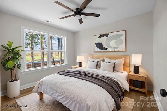 bedroom featuring ceiling fan and hardwood / wood-style floors