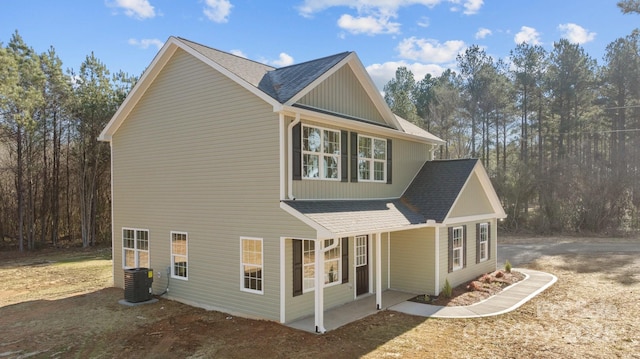 view of side of property featuring central AC unit