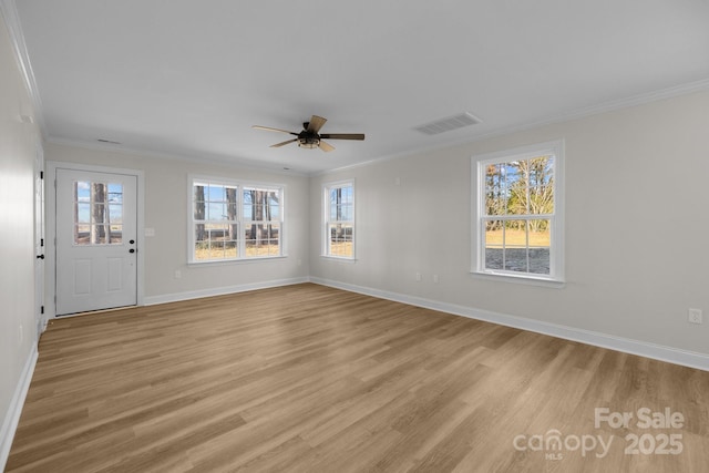 interior space featuring ornamental molding, ceiling fan, and light wood-type flooring