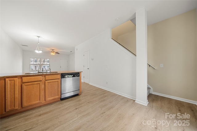 kitchen with stainless steel dishwasher, ceiling fan, sink, pendant lighting, and light hardwood / wood-style flooring