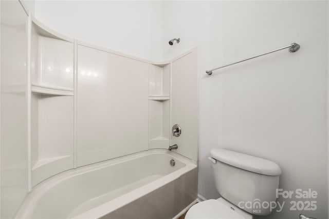 bathroom featuring toilet and tub / shower combination