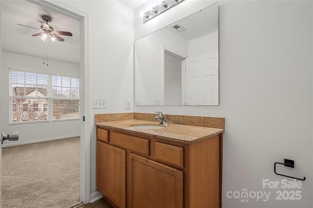 bathroom featuring ceiling fan and vanity