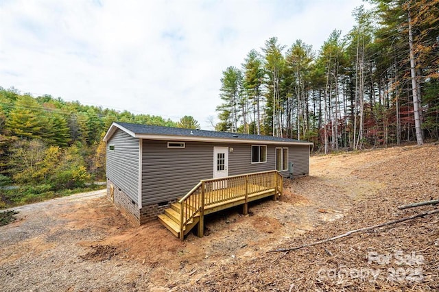 back of house featuring a deck