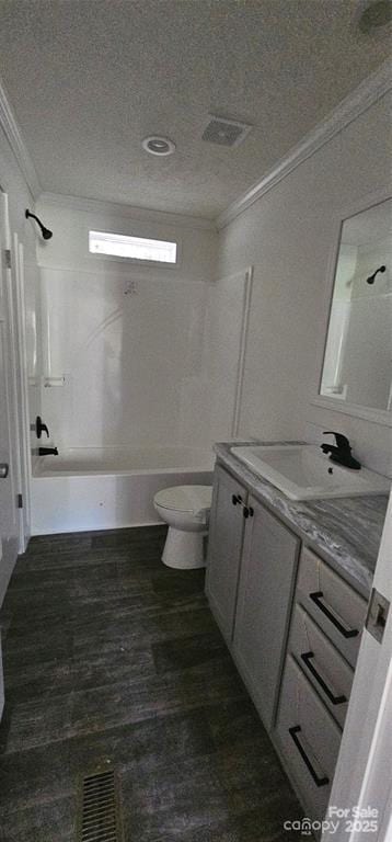 full bathroom featuring ornamental molding, vanity, shower / tub combination, wood-type flooring, and toilet