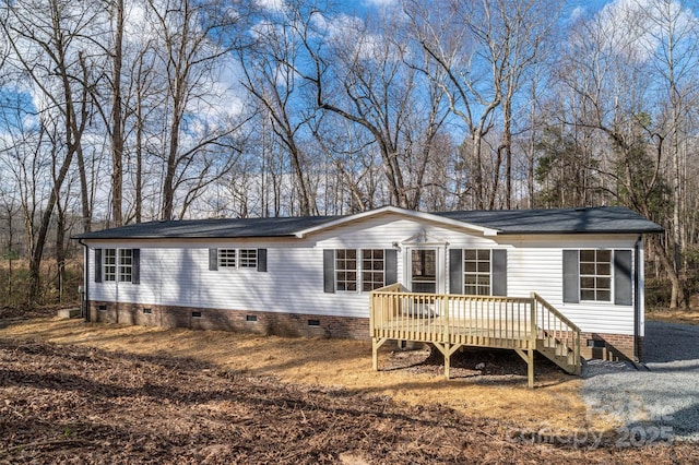 view of front of home featuring a wooden deck