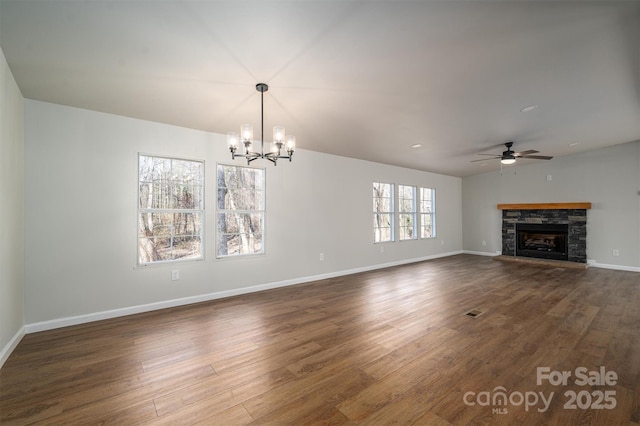 unfurnished living room with a fireplace, dark hardwood / wood-style flooring, and ceiling fan with notable chandelier