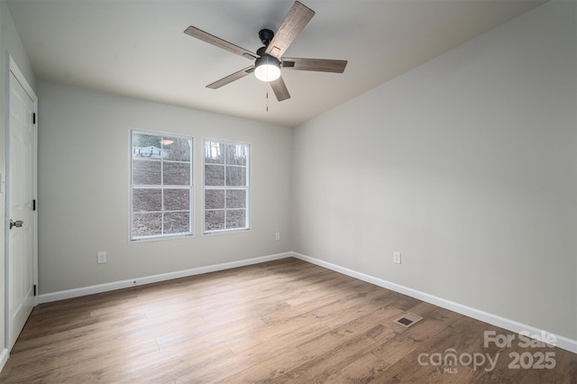 empty room with light hardwood / wood-style floors and ceiling fan