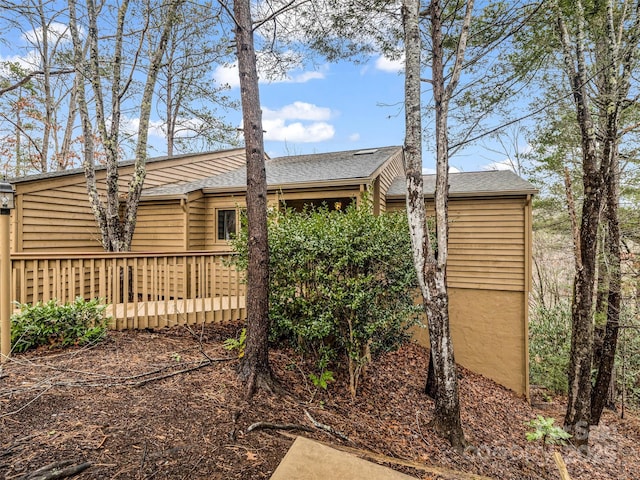 155 Quail Cove Blvd Unit 1615, Lake Lure, NC 28746 - view of side of property featuring a deck and a shingled roof