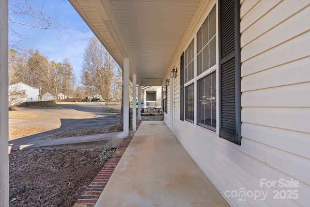 view of patio featuring a porch