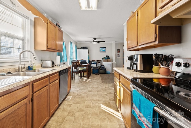 kitchen with sink, ceiling fan, crown molding, and appliances with stainless steel finishes