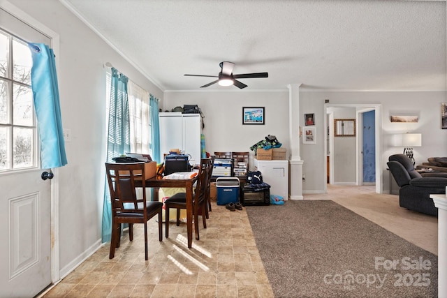 dining area with a textured ceiling, ornate columns, crown molding, ceiling fan, and light carpet