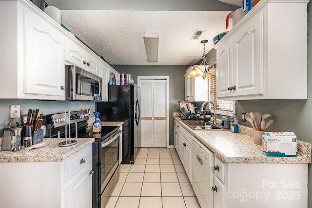 kitchen with pendant lighting, sink, white cabinets, and stainless steel appliances