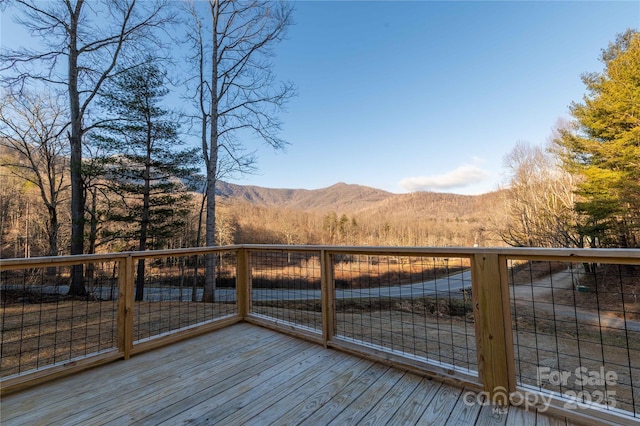 wooden terrace featuring a mountain view