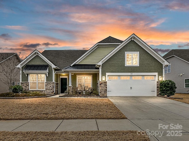 craftsman house with a garage