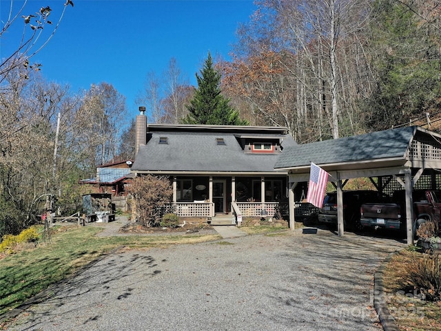 41 Cottontail Ln, Canton, NC 28716 - view of front of house with covered porch, a chimney, driveway, a shingled roof, and a carport