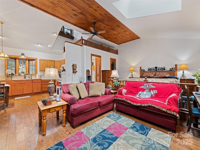 41 Cottontail Ln, Canton, NC 28716 - living area featuring a skylight, light wood-type flooring, ceiling fan, and high vaulted ceiling