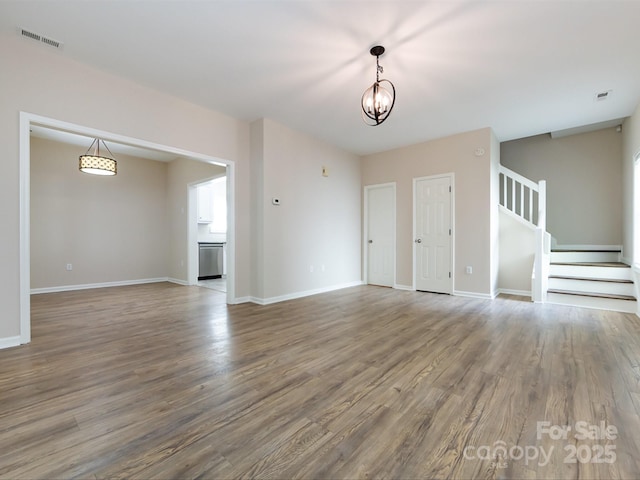 interior space with hardwood / wood-style flooring and a chandelier