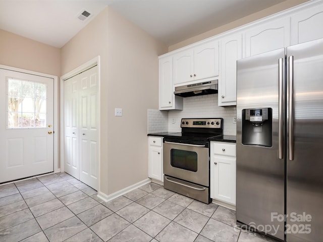 kitchen featuring white cabinets, light tile patterned floors, backsplash, and appliances with stainless steel finishes