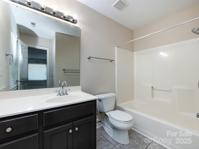 full bathroom with tile patterned flooring, vanity, tub / shower combination, and toilet