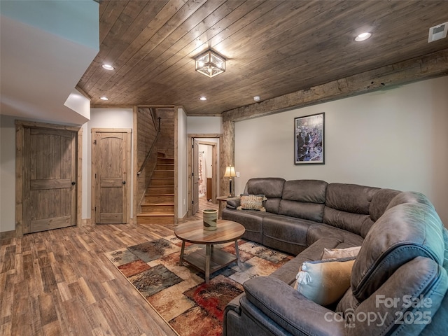 living room featuring wood ceiling and hardwood / wood-style flooring