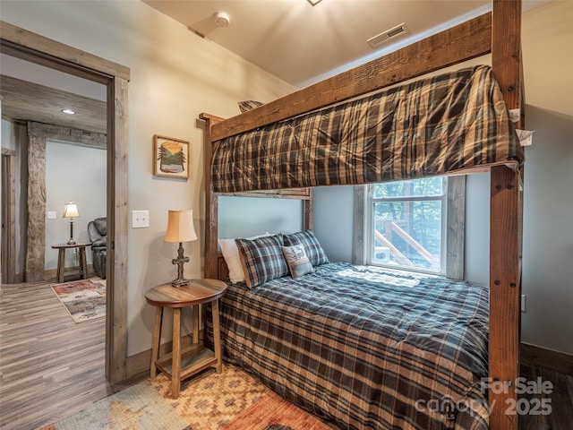 bedroom featuring hardwood / wood-style flooring