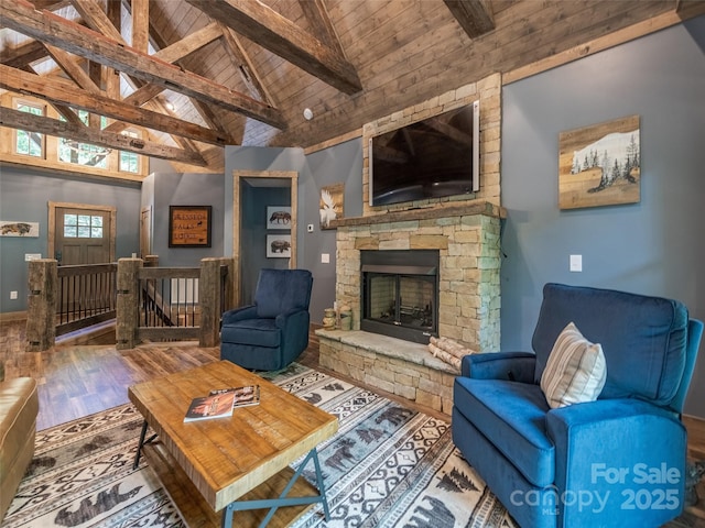 living room with a fireplace, high vaulted ceiling, wooden ceiling, beamed ceiling, and hardwood / wood-style floors