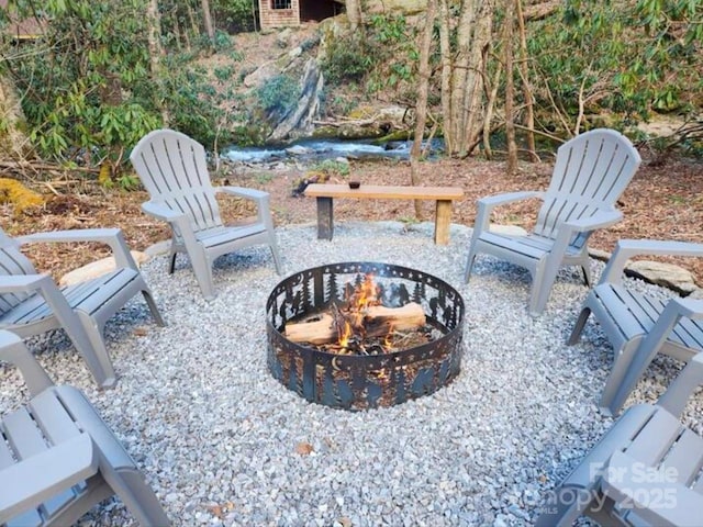 view of patio featuring a fire pit