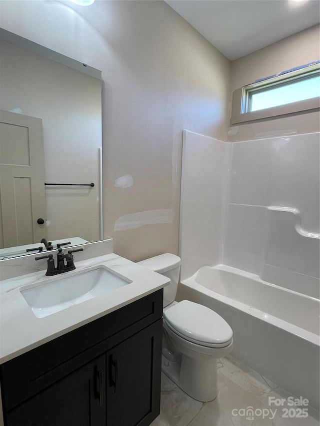 full bathroom featuring vanity, tub / shower combination, and toilet