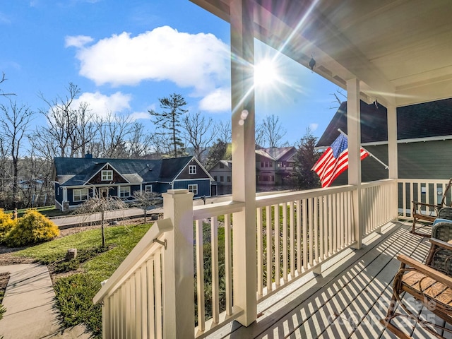 wooden terrace featuring covered porch