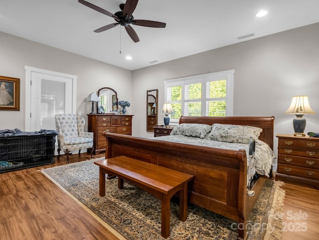 bedroom with hardwood / wood-style flooring and ceiling fan