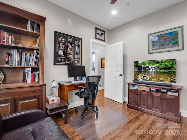 office area featuring ceiling fan and light wood-type flooring