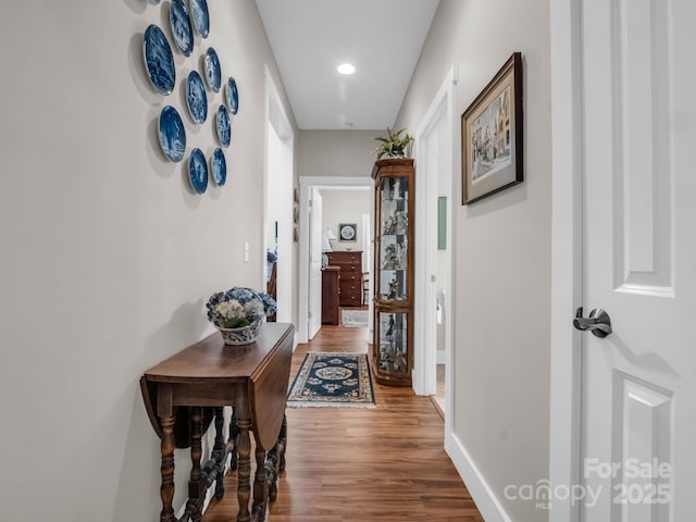 corridor featuring hardwood / wood-style flooring