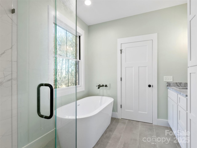 bathroom featuring tile patterned flooring, vanity, plenty of natural light, and independent shower and bath