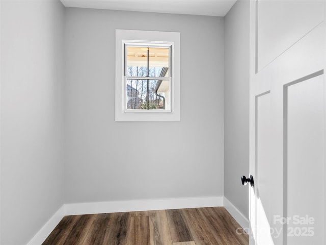 unfurnished room with dark hardwood / wood-style floors