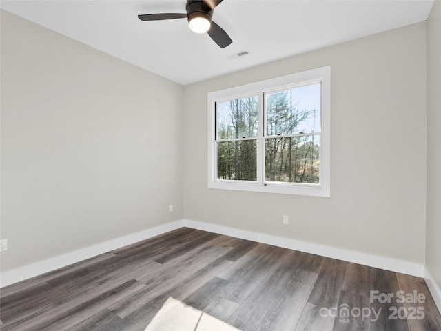 spare room featuring ceiling fan and hardwood / wood-style floors