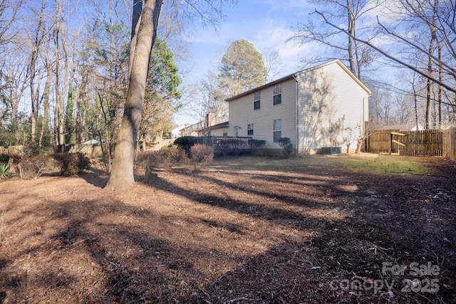 exterior space featuring cooling unit and a deck