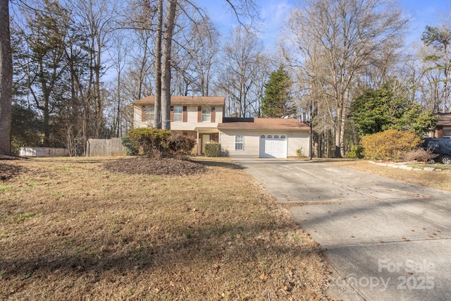 view of front facade with a front yard and a garage