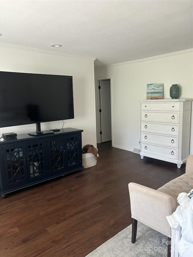 living room with crown molding and dark hardwood / wood-style floors