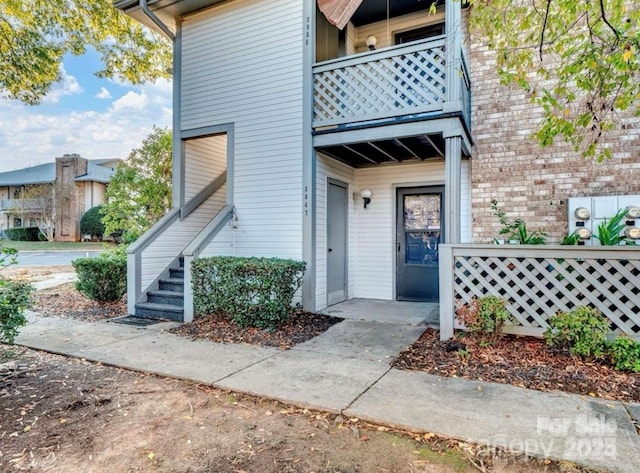 doorway to property with a balcony