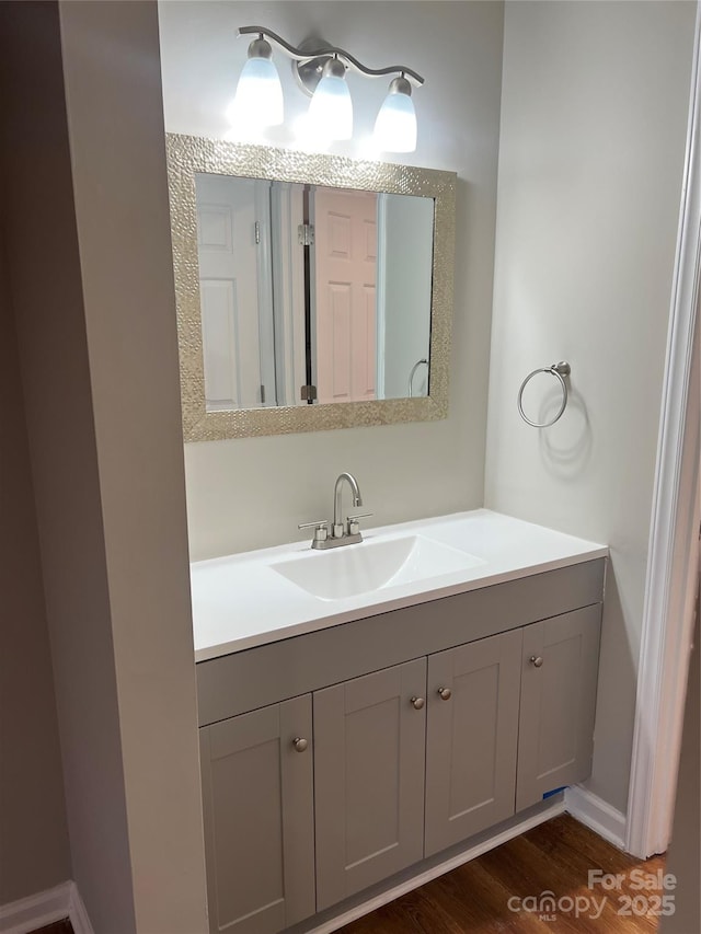 bathroom featuring vanity and hardwood / wood-style flooring