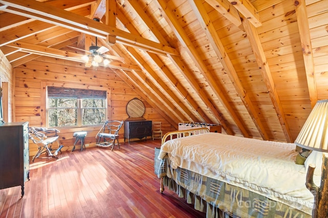 bedroom with wood-type flooring, wooden walls, vaulted ceiling with beams, and wooden ceiling