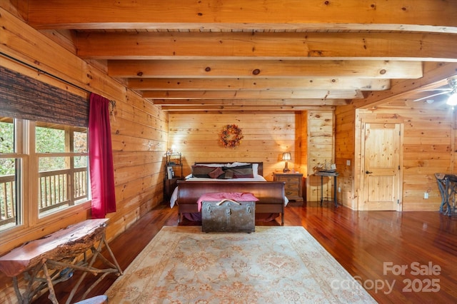 bedroom featuring beam ceiling, wooden walls, and dark hardwood / wood-style floors