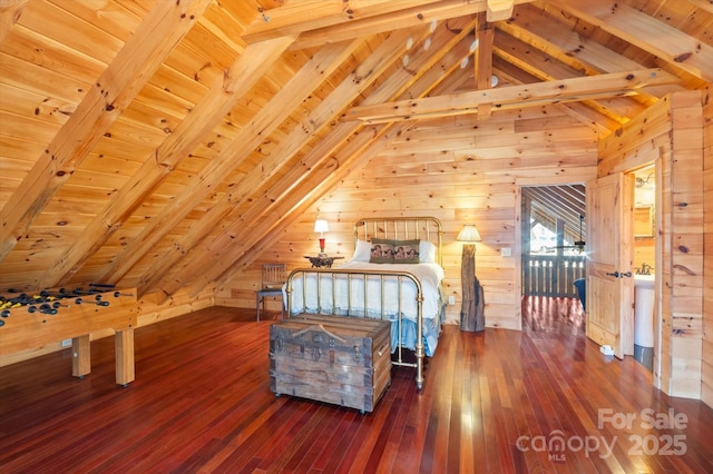 unfurnished bedroom featuring lofted ceiling with beams, dark hardwood / wood-style floors, wooden ceiling, and wood walls