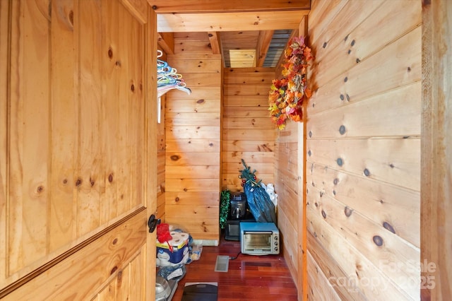 interior space featuring wood walls and wood-type flooring