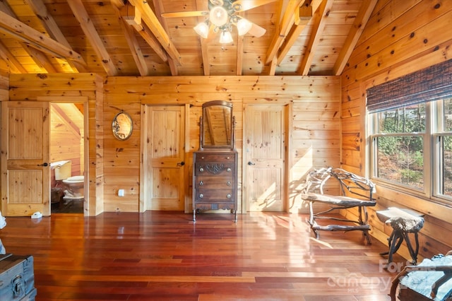 sitting room featuring hardwood / wood-style floors, beam ceiling, wood walls, and wood ceiling