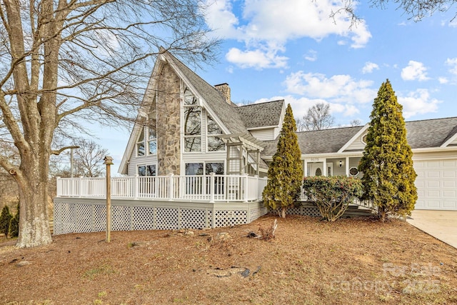 exterior space featuring a garage and a deck