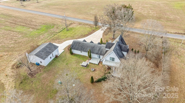 birds eye view of property featuring a rural view