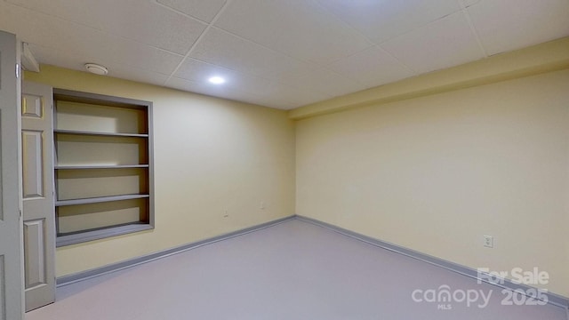 empty room with built in shelves